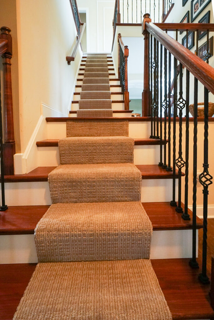 partially carpeted steps leading up a staircase