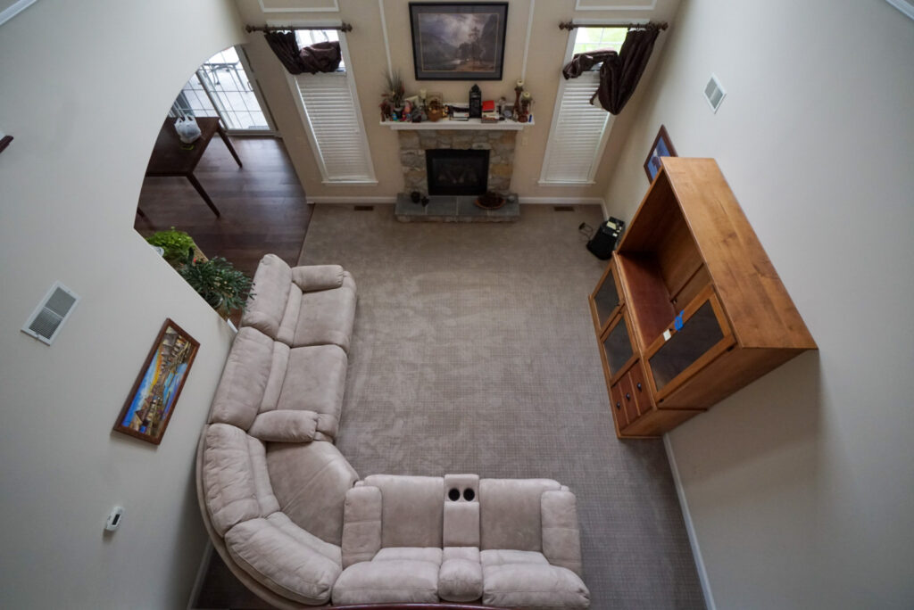 an overhead view of a new living room carpet installation
